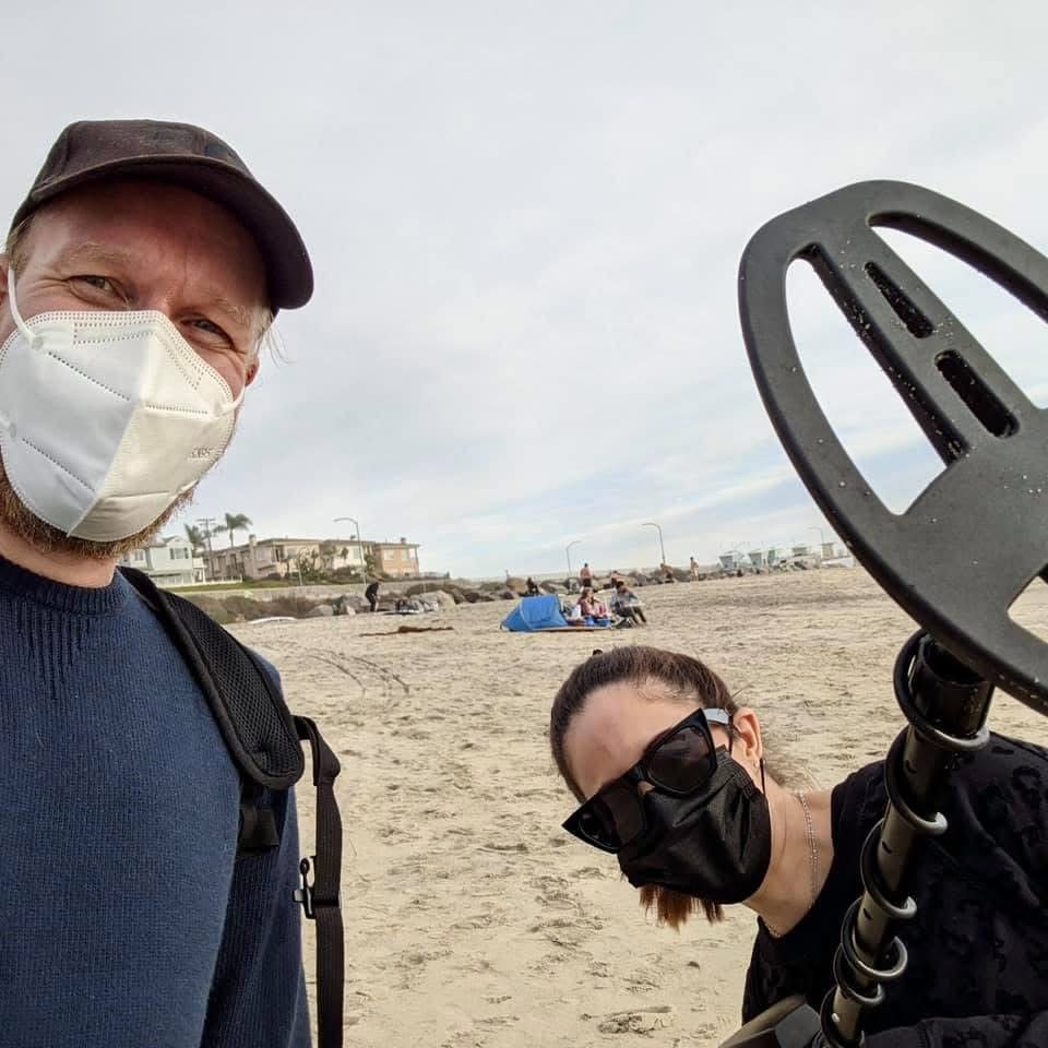 Jessica and Juha on the beach with a metal detector
